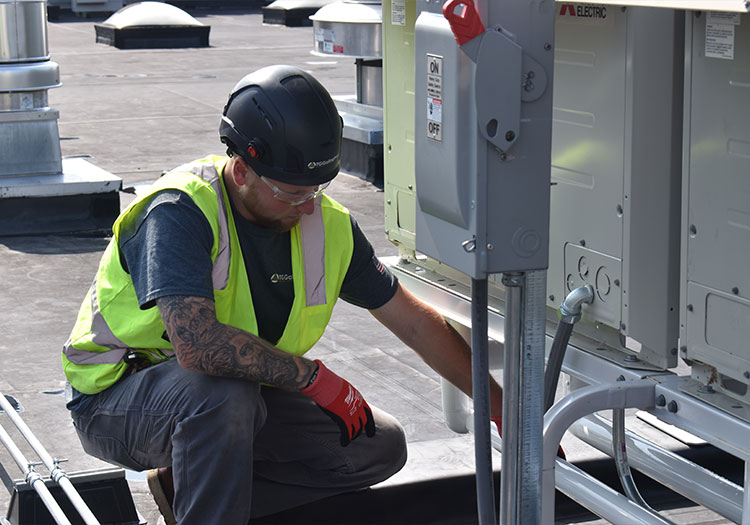 Man working on a roof top system